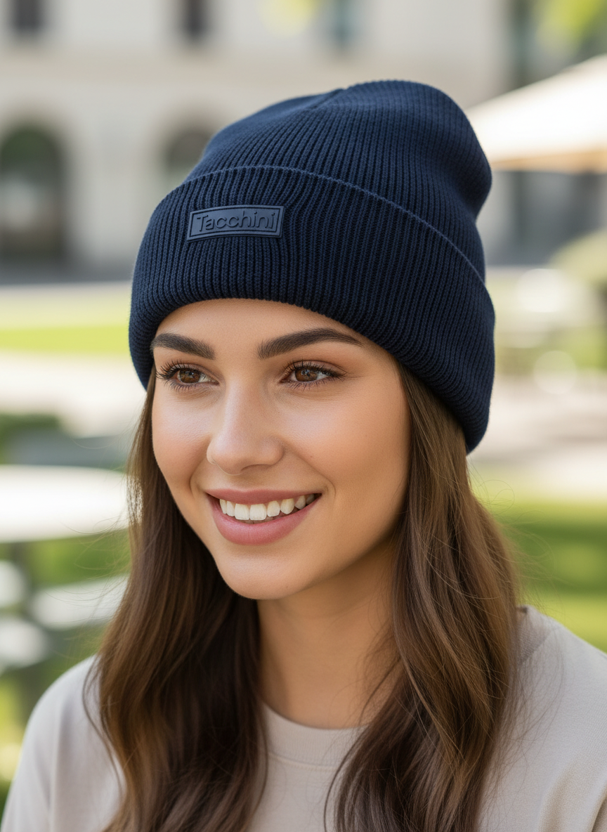 Navy blue beanie with a brand logo on a white background